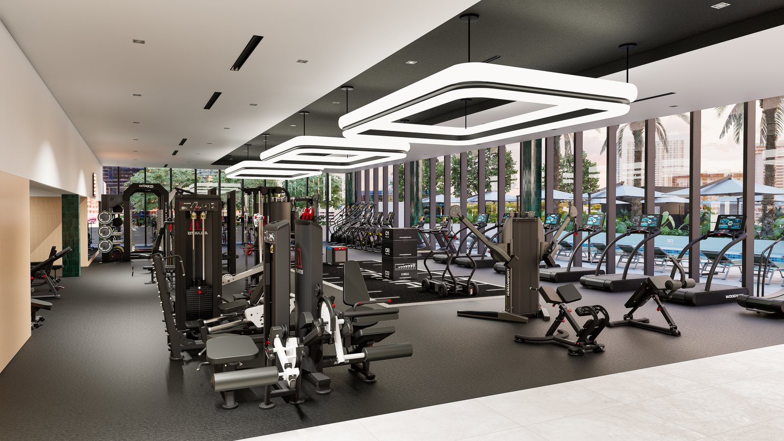 Luxury residential fitness center with strength machines and cardio lined along poolside windows