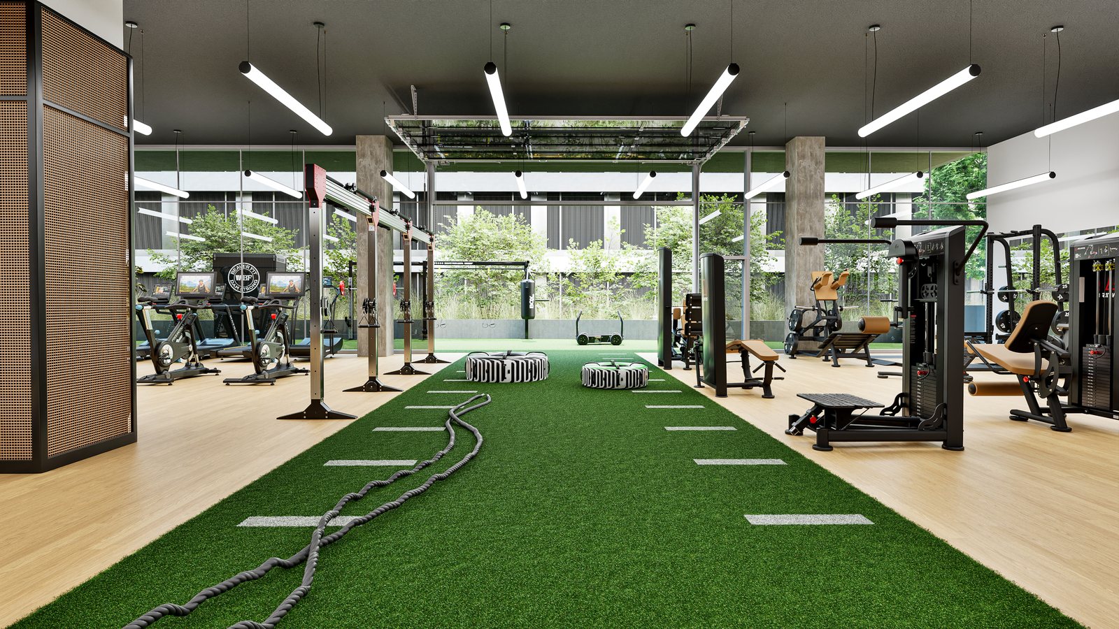 Fitness floor with a turf sled lane, functional rigs, selectorized strength and bikes from multiple manufacturers